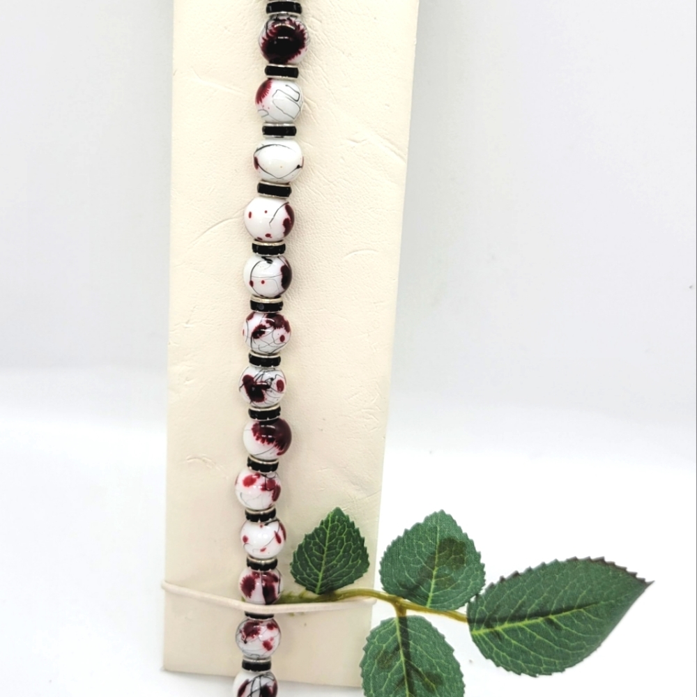 Red, White, and Black variegated Glass & Black Crystal Bracelet
